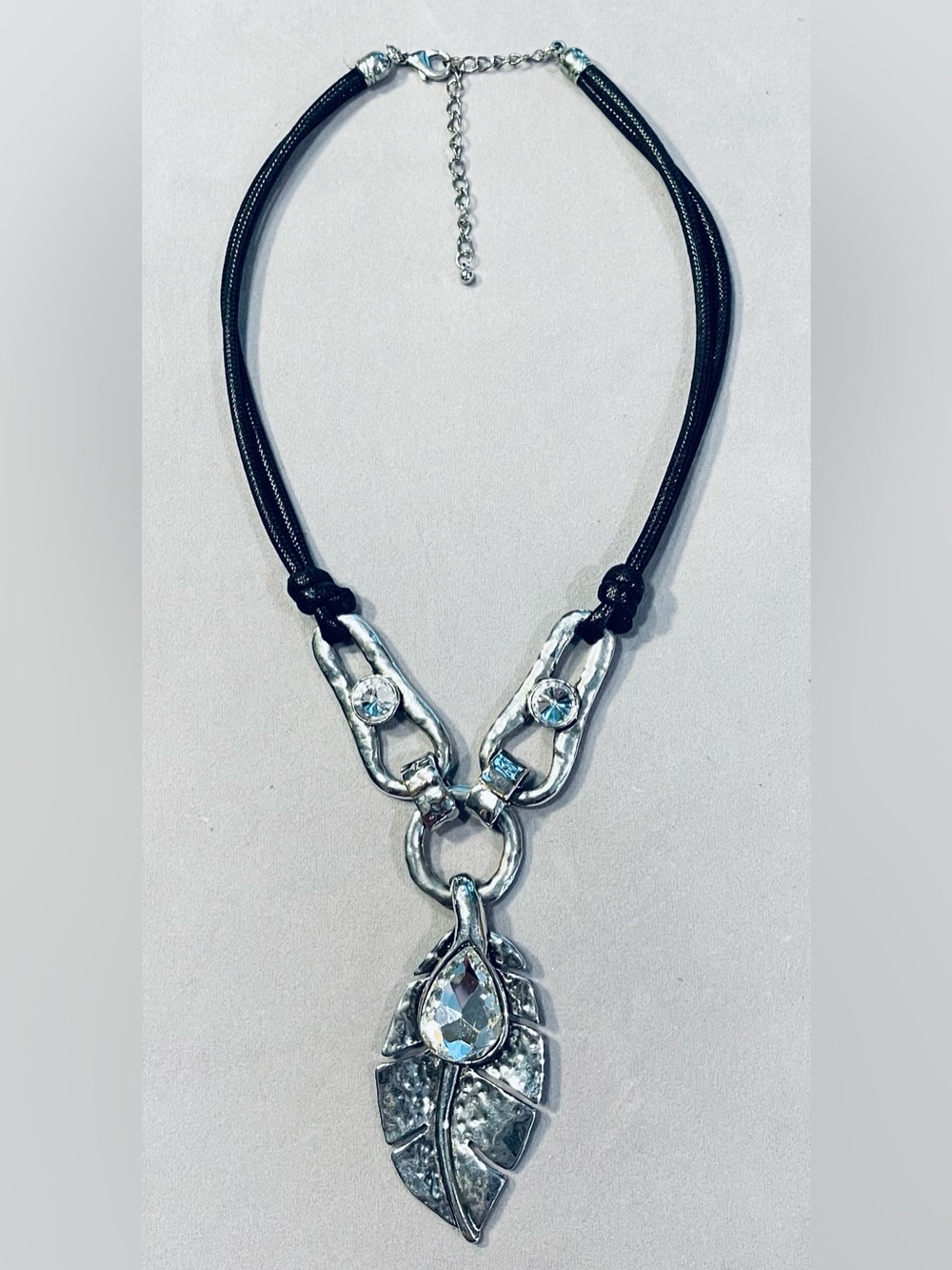 SILVER CRYSTAL LEAF PENDANT W/ SILVER CRYSTAL LINKS & BLACK CORD NECKLACE 12”